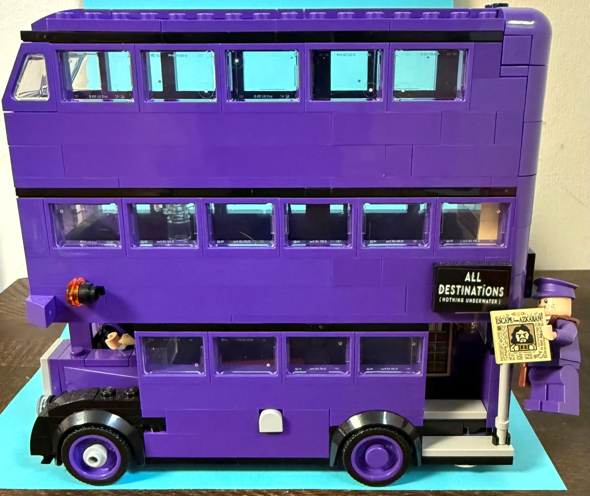Large purple LEGO triple-decker Knight Bus